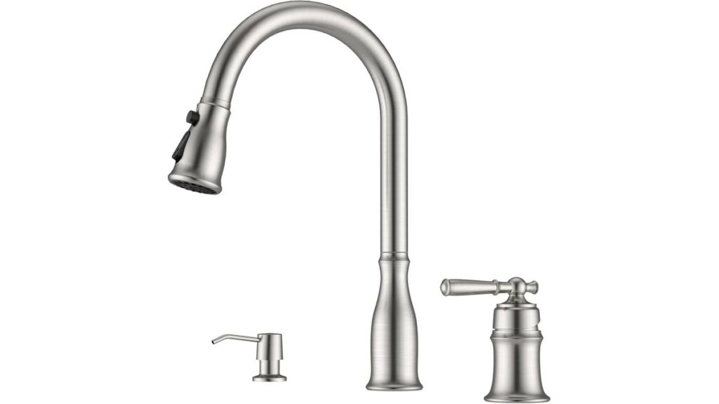 A modern three-hole kitchen faucet installed on a clean white marble countertop.