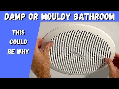 Testing bathroom fan suction with a piece of paper to check for makeup air issues.