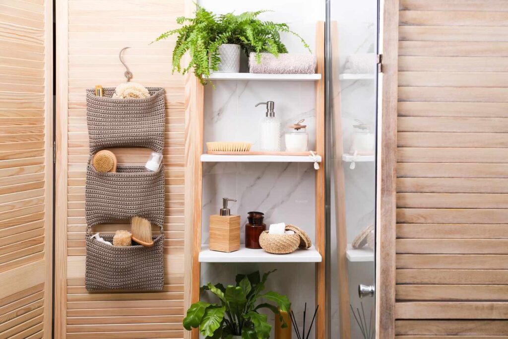 A modern towel rack mounted on a wall saves space in small bathrooms.