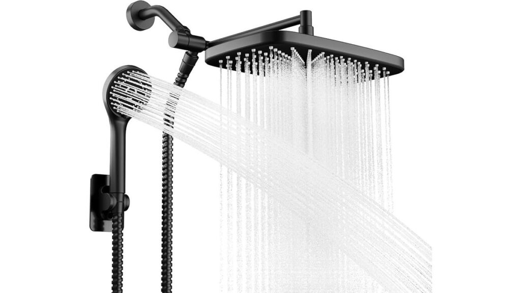 Modern chrome handheld shower head with on off switch inside a luxury shower.