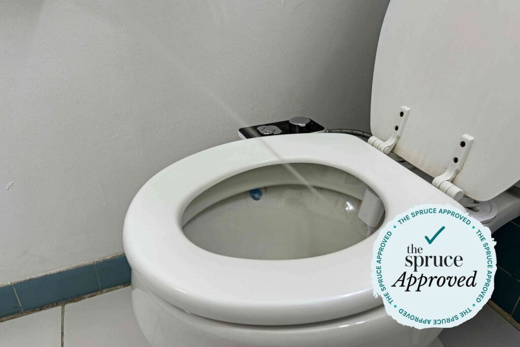 A modern bathroom showcasing a battery operated heated toilet seat in a clean setting.