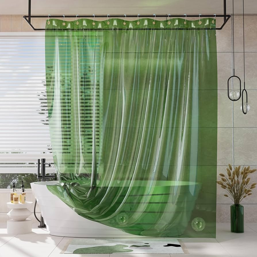 Various high end shower curtain fabrics organized on a bathroom vanity.