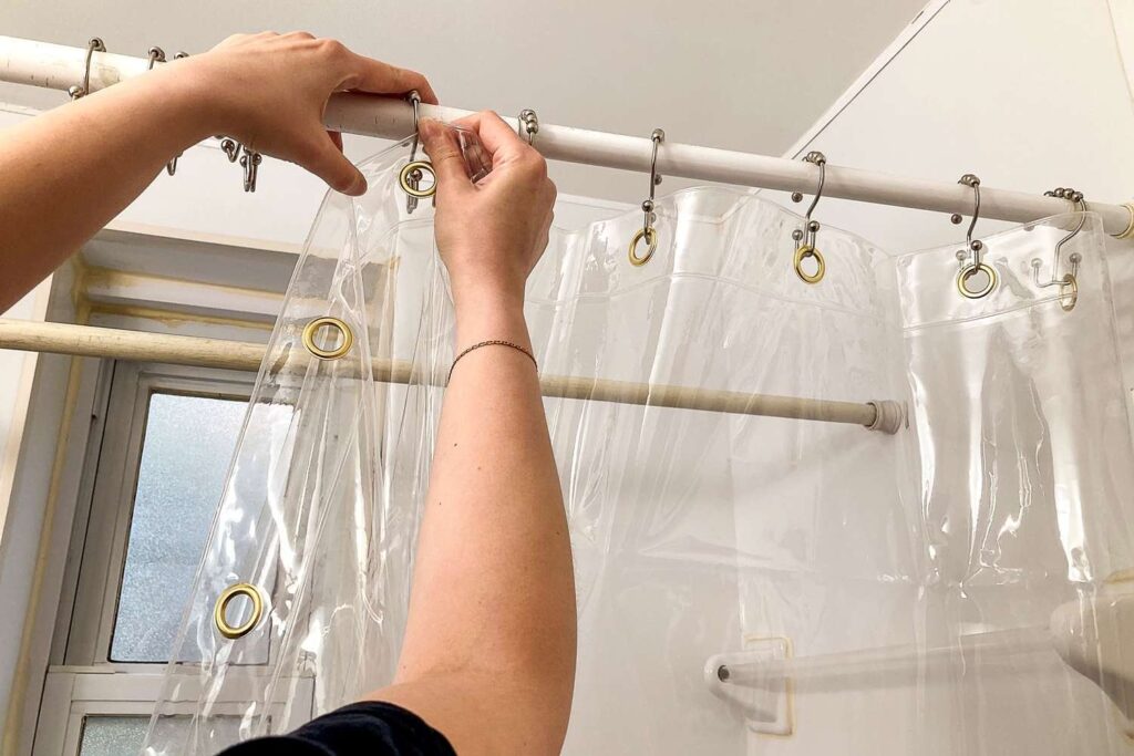 A luxurious bathroom featuring a high end shower curtain with a weighted liner.