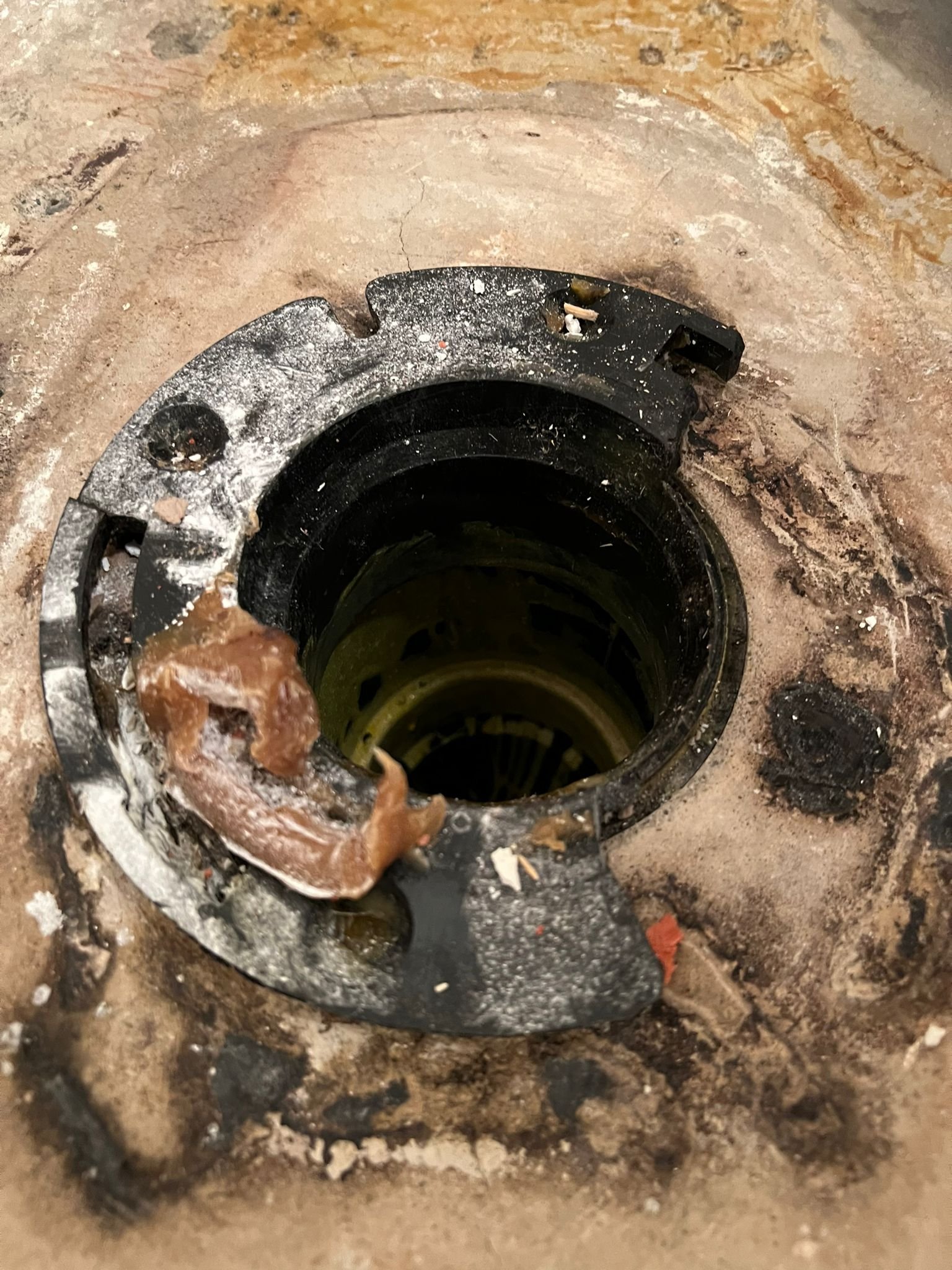 Professional plumbing tools arranged on a cloth for toilet repair and maintenance.