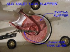 A clean open toilet tank showing the rubber flapper valve mechanism inside.