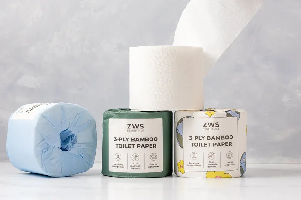 A roll of toilet paper on a marble counter represents septic safe bathroom tissue.