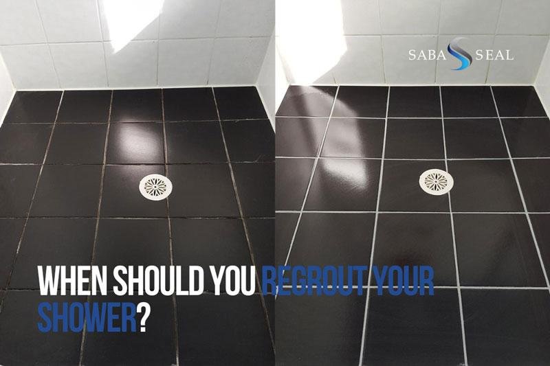 Close-up of damaged and moldy grout lines between bathroom shower tiles.