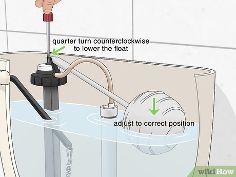 A close-up of a toilet tank fill valve showing sediment buildup on the tube.