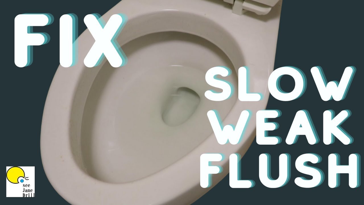 Hands using a closet auger to clear a clog from a white toilet drain.