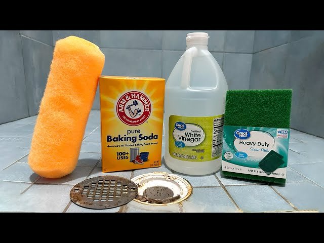 Organized bathroom cleaning tools placed on a modern vanity counter.