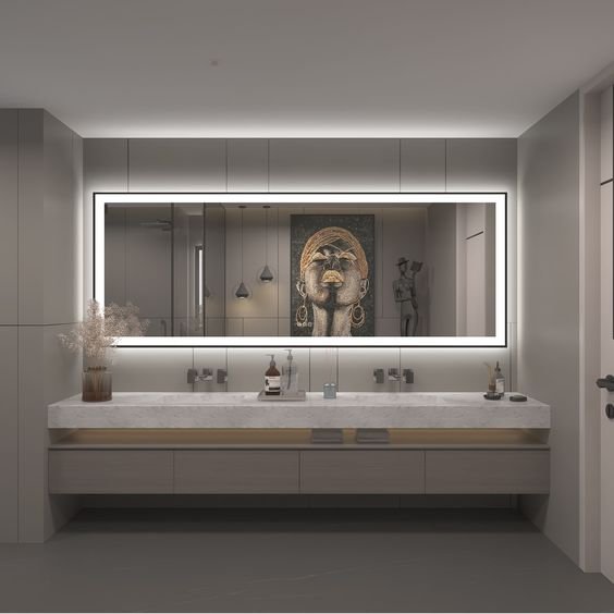 A professional checking installation steps for a bathroom vanity mirror on a phone.