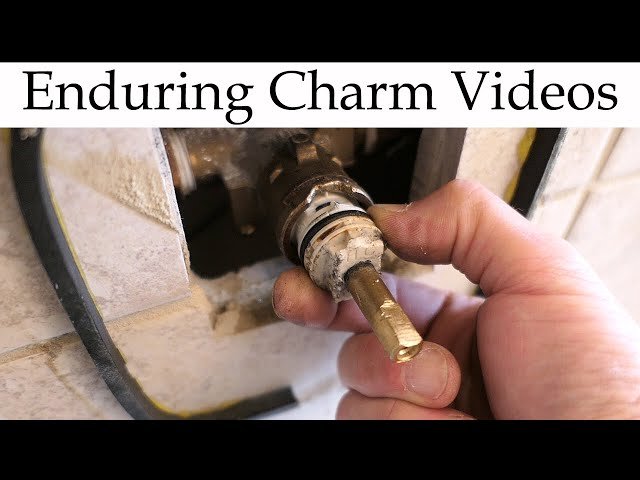 A dry shower faucet handle demonstrating a successful shower cartridge replacement without leaks.