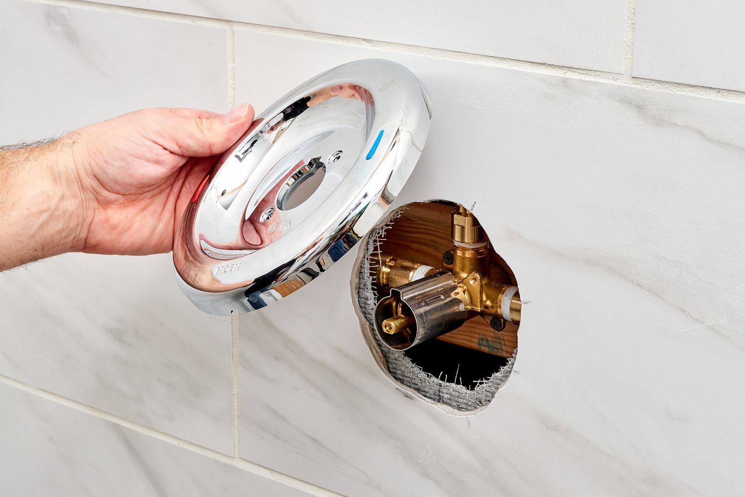 A clean bathroom setting used as a backdrop for answering shower cartridge questions.