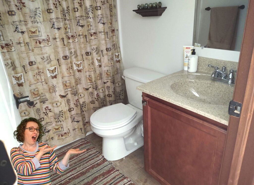 A modern bathroom exhaust fan mounted in a clean, neutral-toned ceiling.