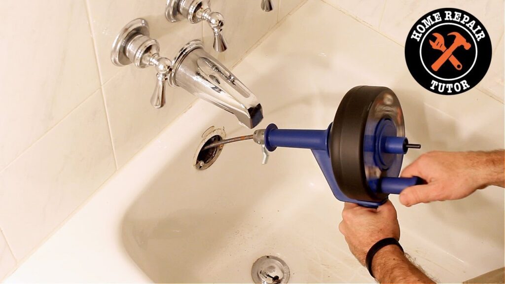 A modern shower drain with water pooling around it on a tiled floor.