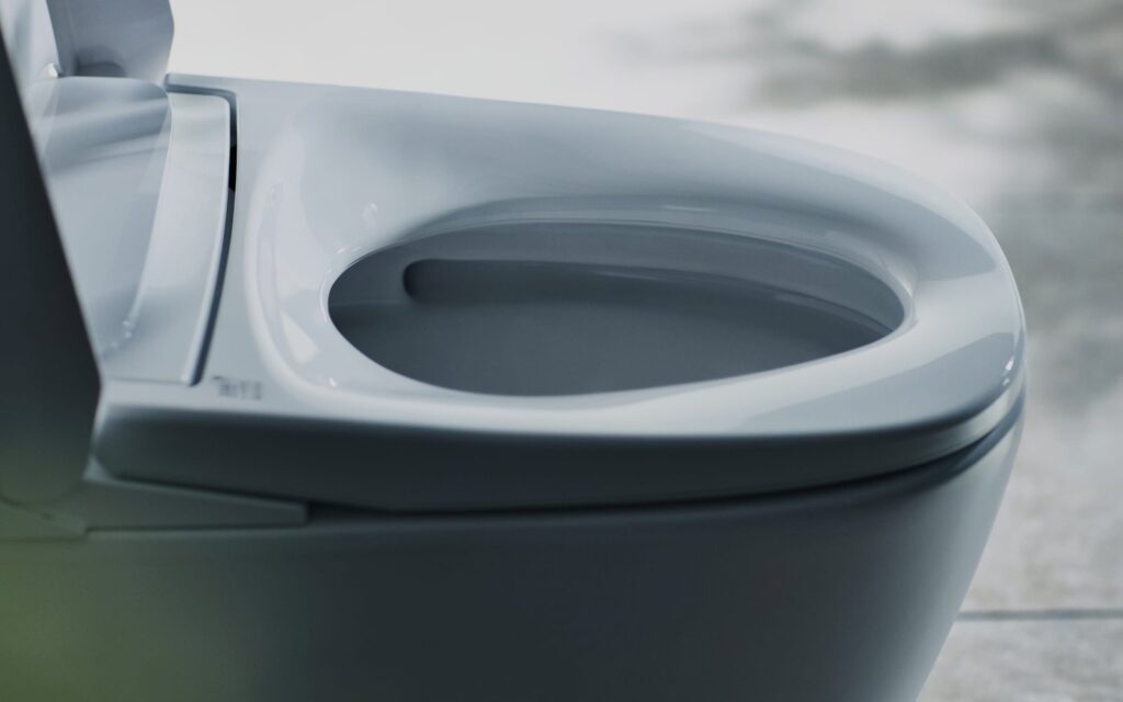 A clean and modern bathroom interior showcasing high standards of toilet usability and hygiene.