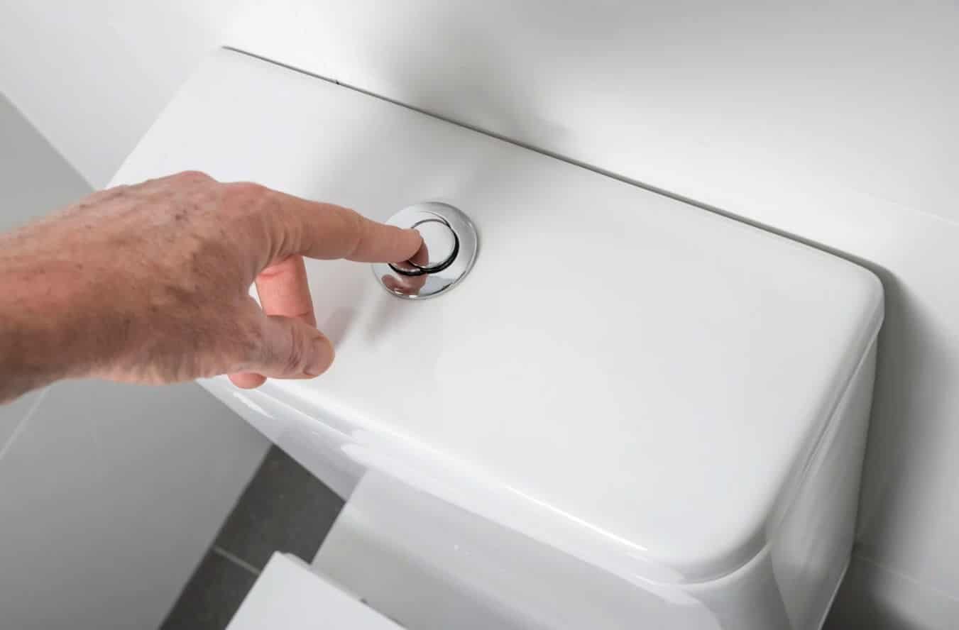 Essential plumbing tools laid out for home toilet repair and maintenance.