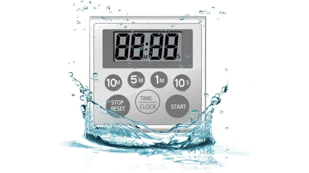 A minimalist waterproof clock mounted on a modern bathroom wall near a shower.