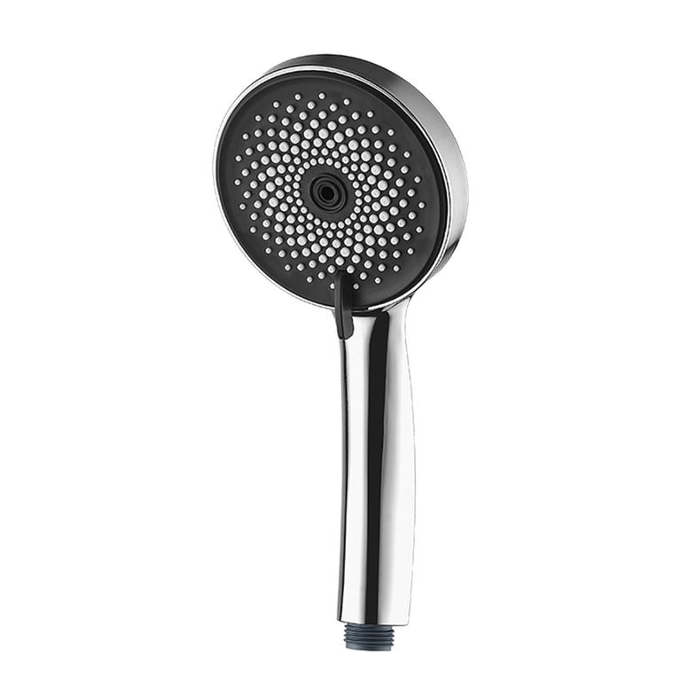 Hand cleaning mineral buildup from a rainfall shower head to improve water pressure flow.