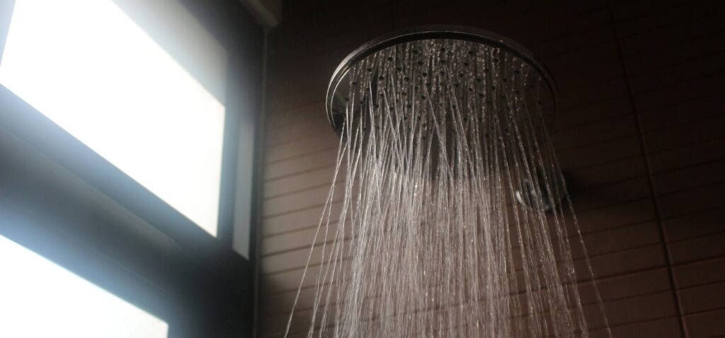 Modern rainfall shower head installed in a clean, minimalist bathroom for optimal water flow.