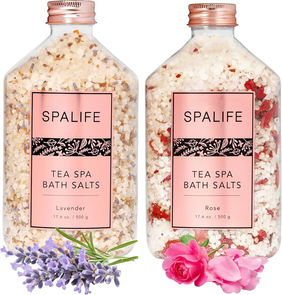 Glass jars of bath salts displayed in a clean, modern bathroom.