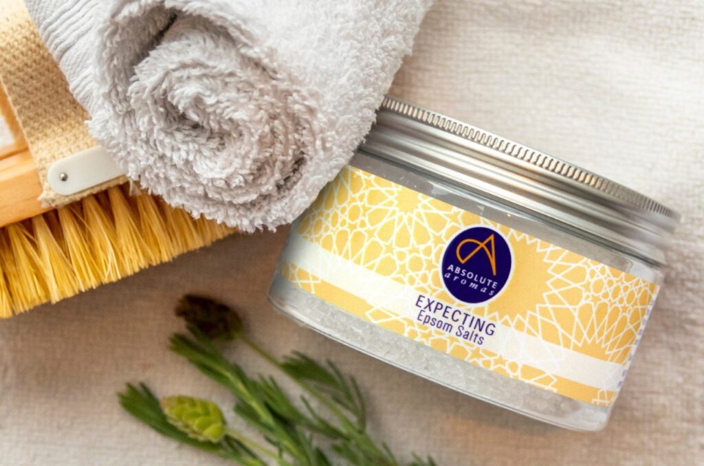 A peaceful bathroom scene featuring bath salts and warm water for relaxation.