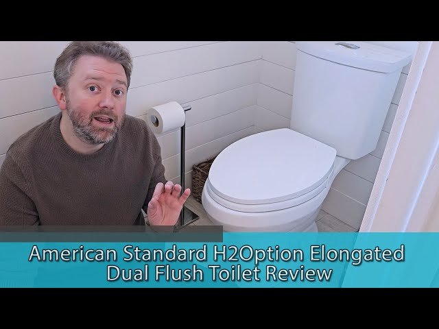 Close up of the dual flush buttons on an American Standard H2Option toilet tank.