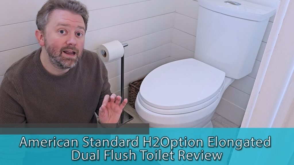 A modern American Standard H2Option dual flush toilet in a bright contemporary bathroom.