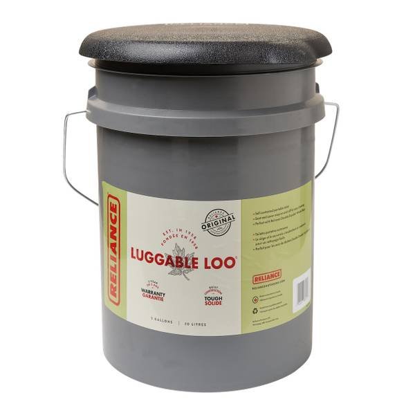 The sturdy Luggable Loo bucket toilet displayed in a bright workshop environment.