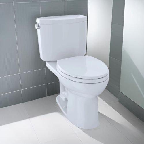 Close-up of the dual-nozzle flushing system inside a white elongated toilet bowl.