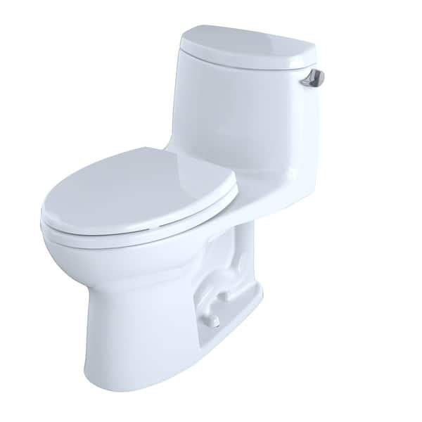 A person adjusting the internal fill valve hardware inside a toilet water tank.