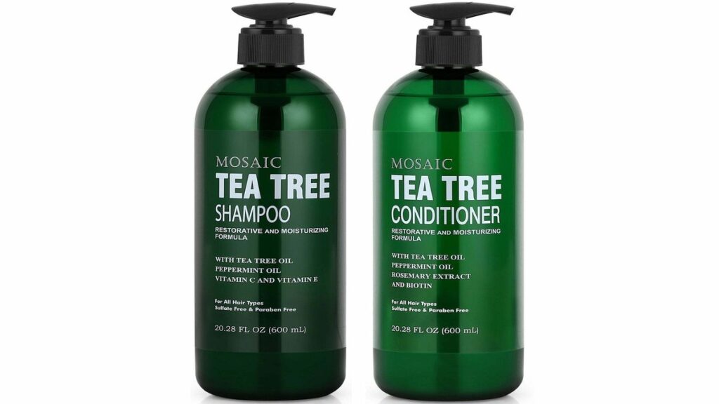 A minimalist tea tree oil shampoo and conditioner set on a marble bathroom surface.
