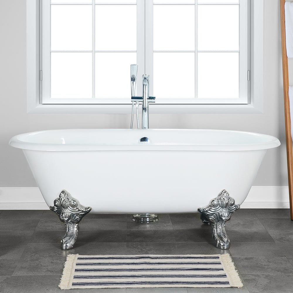 A heavy cast iron claw foot bathtub being installed in a bathroom renovation.