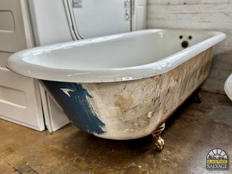 A white cast iron claw foot bathtub creates a luxurious focal point in a bathroom.