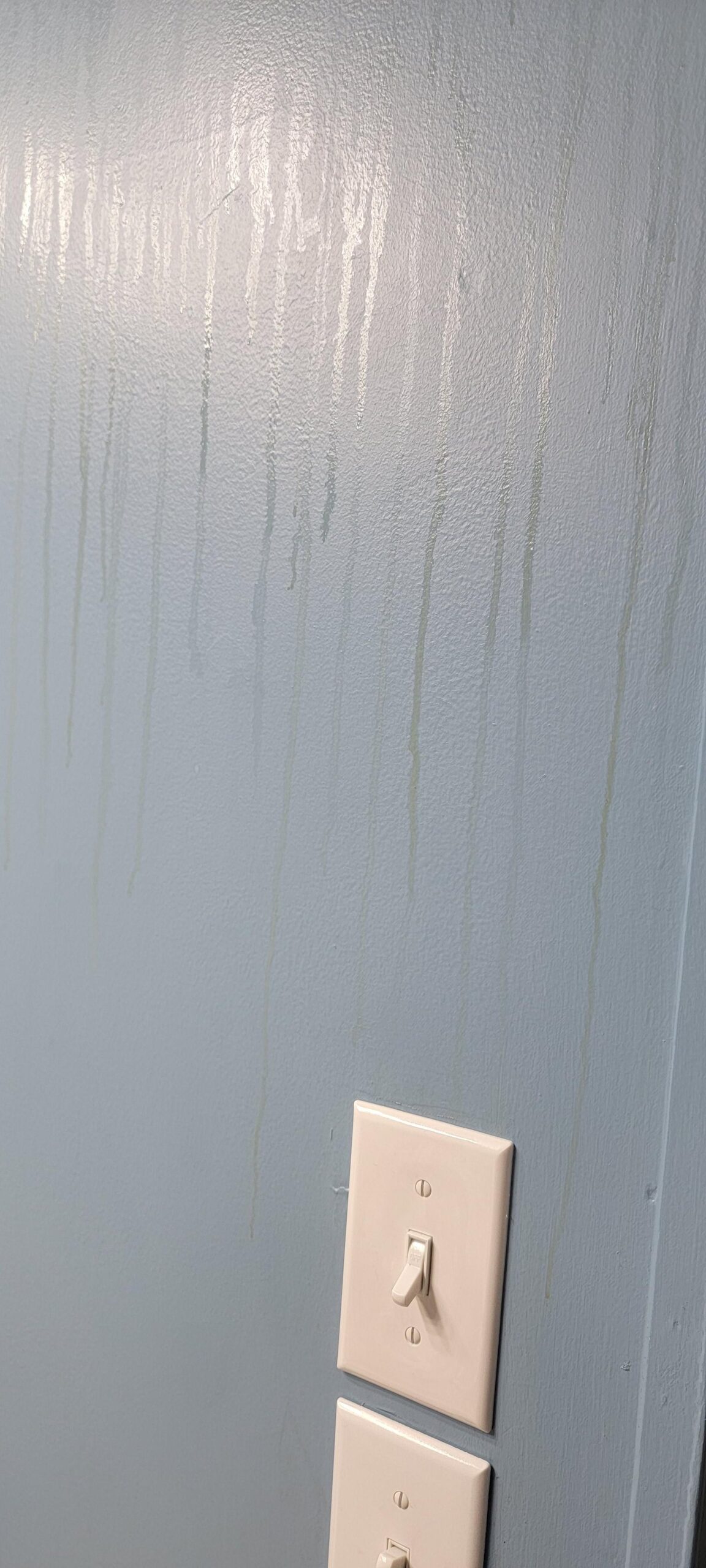 Home maintenance tools ready to inspect water stains in a bathroom.