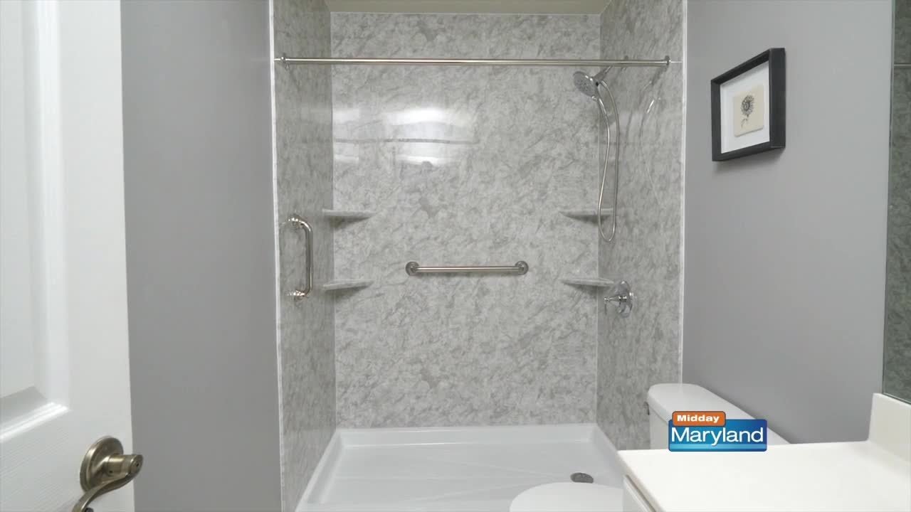 A professional contractor discussing bathroom remodel pricing and details with a homeowner.