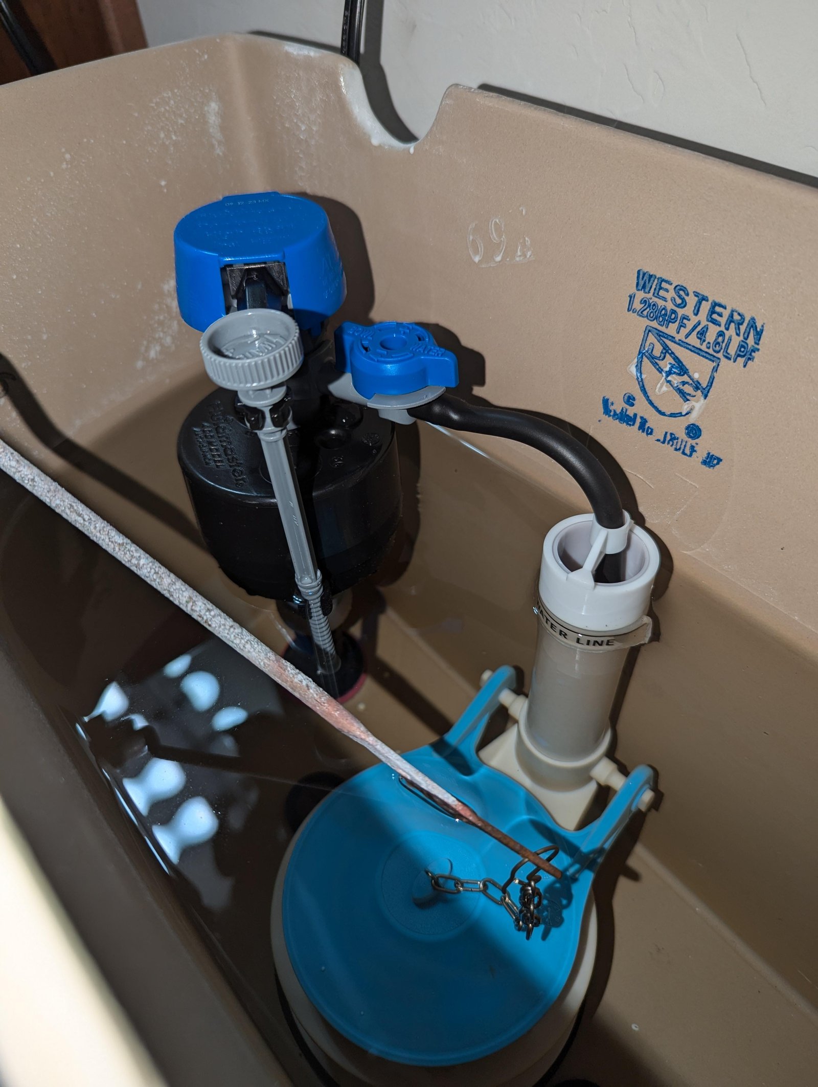A clean, modern bathroom setting for researching toilet maintenance and repairs.