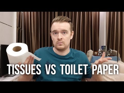 A roll of toilet paper and a box of facial tissues on a bathroom counter.