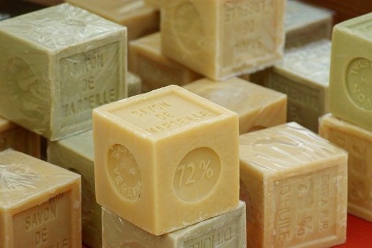 A variety of skincare items on a vanity representing different cleansing needs.