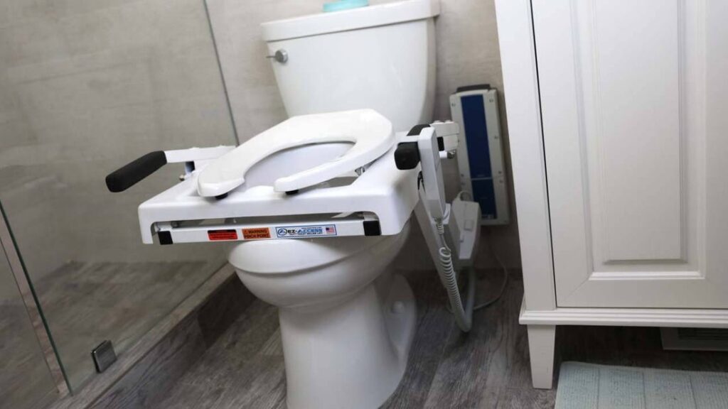 A modern extra-tall toilet sits in a bright and minimalist bathroom space.