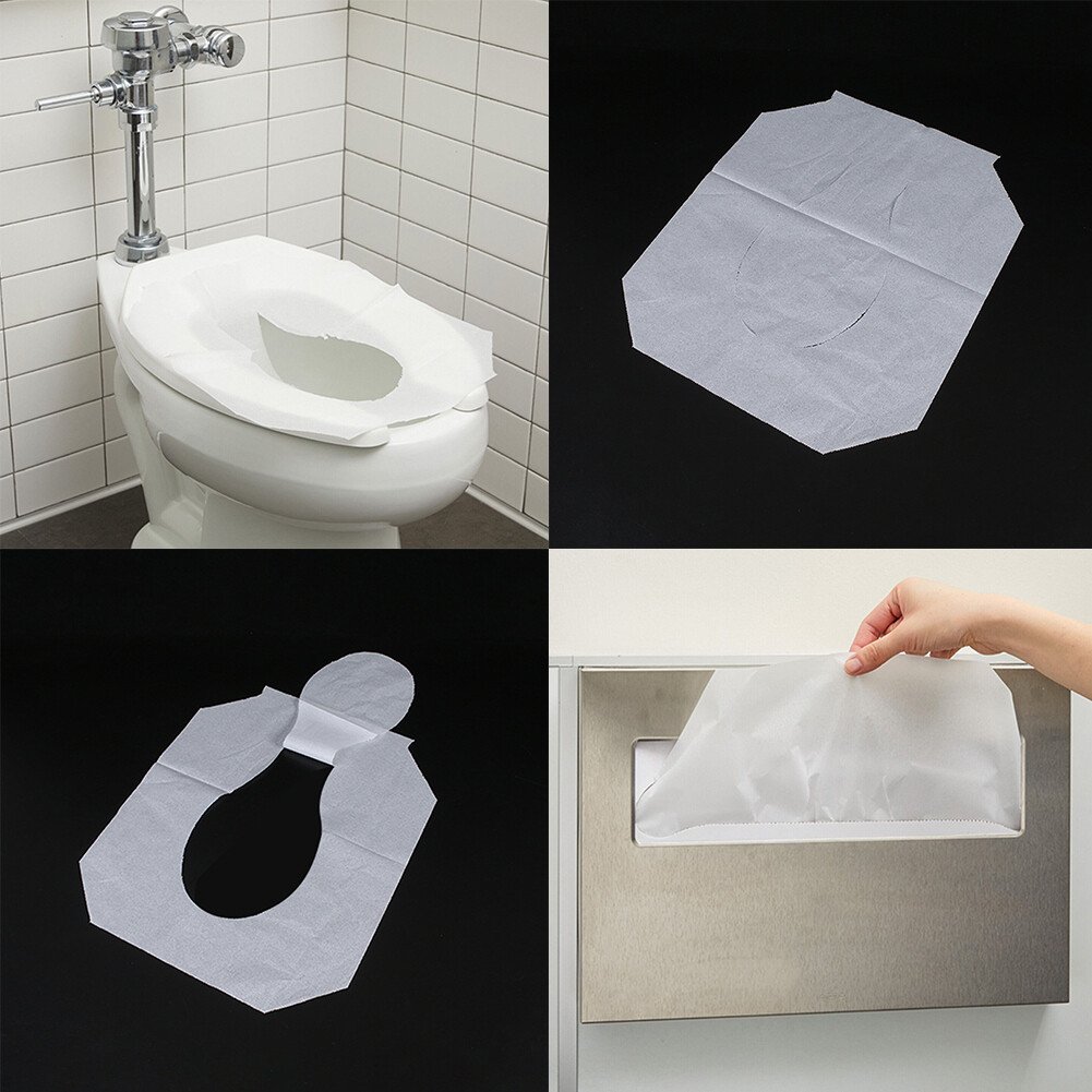 A properly placed paper toilet seat cover resting flat on a white seat.