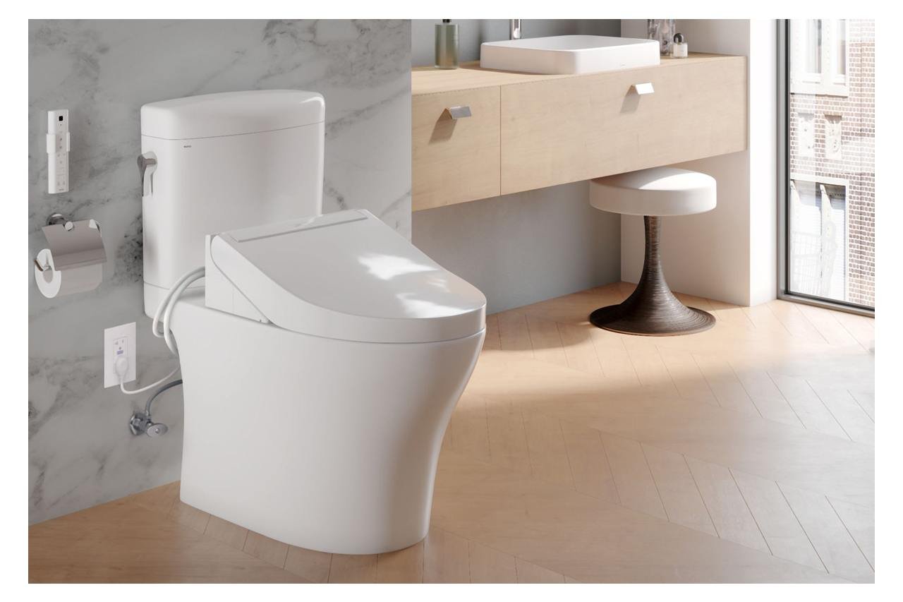 Various toilet seat material samples displayed on a clean bathroom counter.