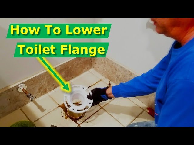 The toilet flange sits too high above the finished bathroom tile floor.
