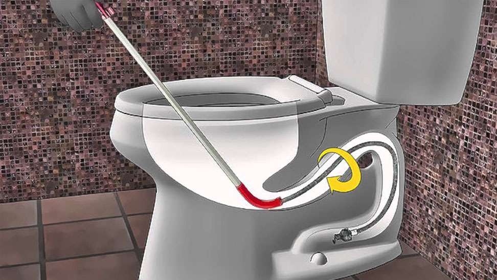 Plumbing tools and an informational guide placed neatly on a bathroom vanity.