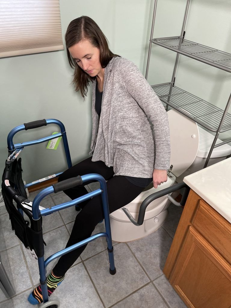 Informational materials regarding hip replacement recovery resting on a table.