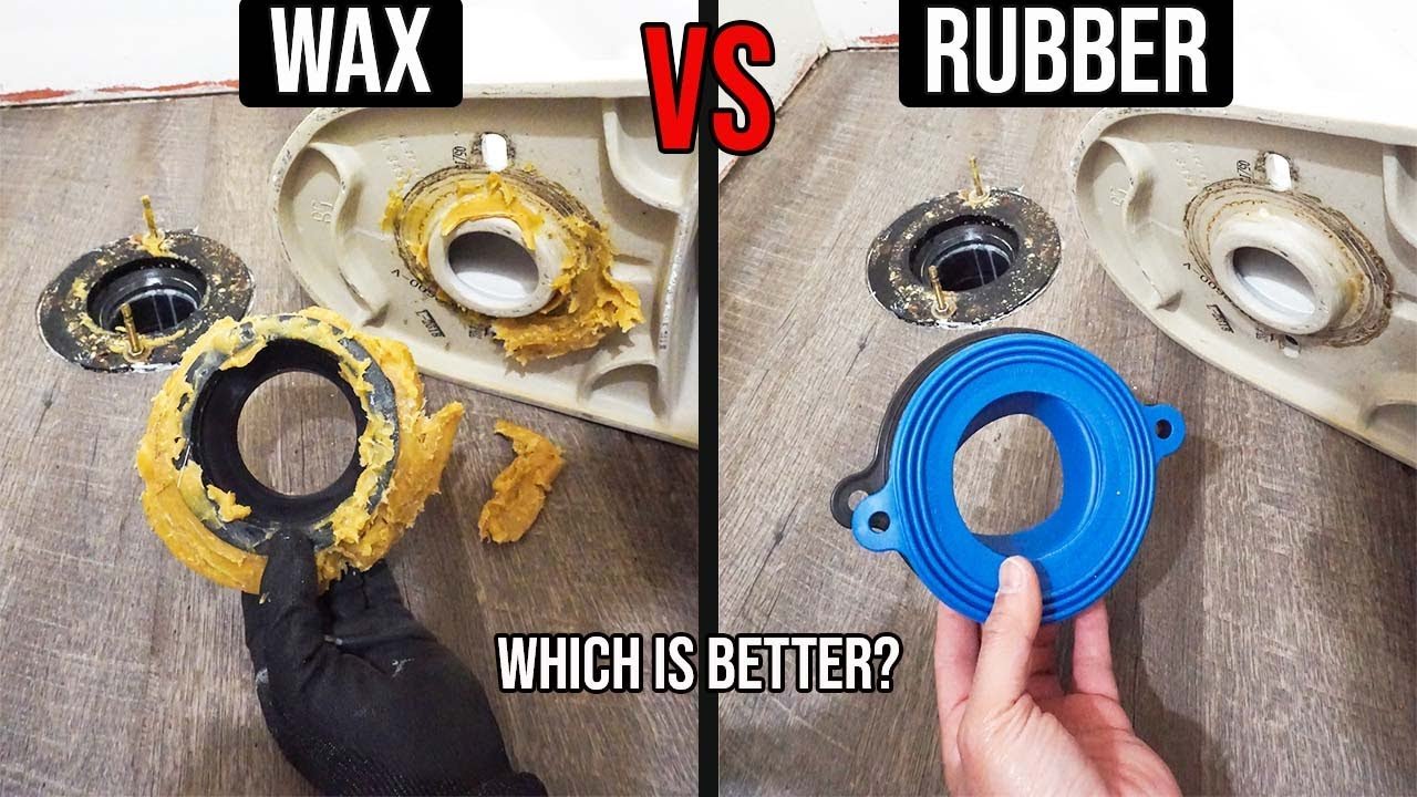 Installing a horned wax ring with a plastic funnel into a drain pipe.
