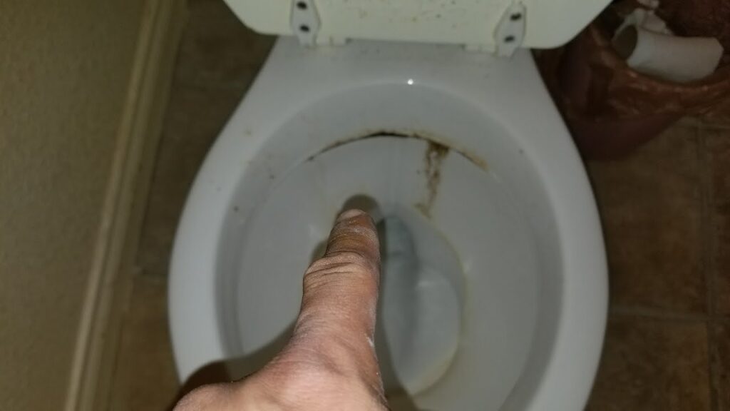 A modern and clean bathroom interior showing a well-maintained toilet and sink.