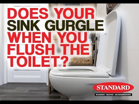 Cross section of residential plumbing showing pipes connecting a toilet and bathtub.